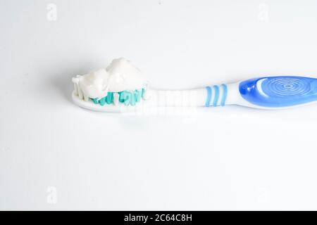 Toothbrush with toothpaste isolated on white background Stock Photo