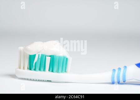 Toothbrush with toothpaste isolated on white background Stock Photo