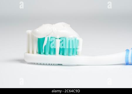 Toothbrush with toothpaste isolated on white background Stock Photo
