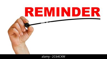 Hand underlining Reminder with red marker Stock Photo