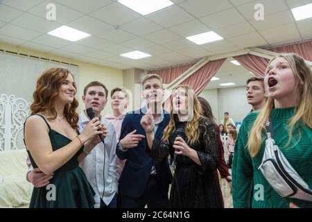Balashikha, Russia - February 15, 2015, Excited young people singing and dancing Stock Photo