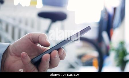 Closeup Man Hand Text Using a Cellphone and Access Network Online Applications, Senior Typing a Message on Mobile Stock Photo