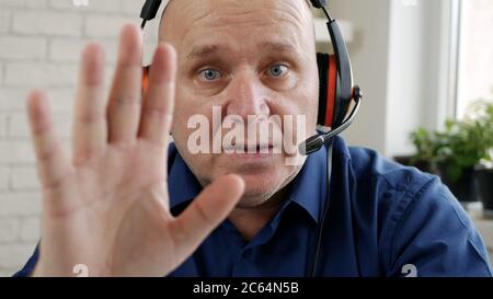 Man Working Remote from Home Using Laptop Connection Stock Photo