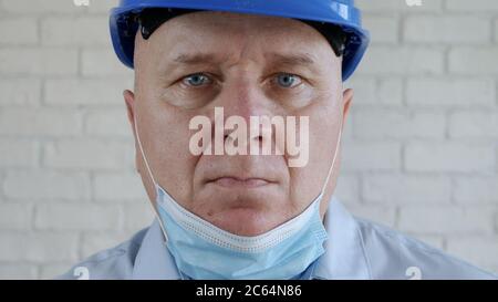 Confident Image with an Engineer Wearing Face Protection Mask Against Viruses. Stock Photo