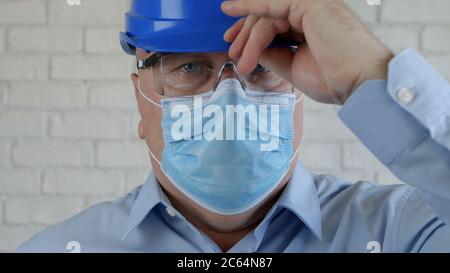 Confident Image with an Engineer Wearing Face Protection Mask Against Viruses. Stock Photo