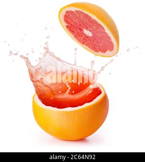 red juice splashing out of a grapefruit isolated on white background Stock Photo