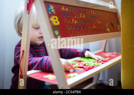 Child playing at home Stock Photo