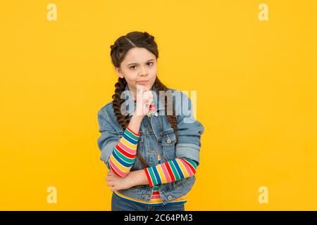 Small but smart. Small girl with thoughtful look. Small child wear long  braided hairstyle. Adorable small baby in casual style. Beauty and fashion.  Hair salon. Children products Stock Photo - Alamy