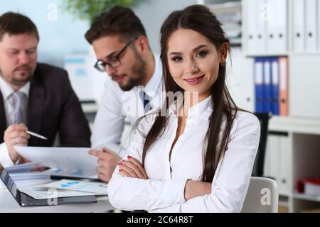 Happy beautiful woman sitting at the work desk Stock Photo