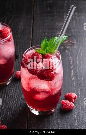 raspberries and raspberry Cocktail in the wooden bowl Stock Photo - Alamy