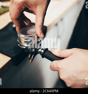 Barista professionally makes aromatic coffee in many ways - the art of brewing Stock Photo
