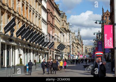 Buchanan Street, Glasgow city centre, people walking in sun beside House of Fraser Department Store, Scotland, UK Stock Photo