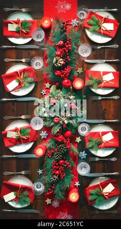 Christmas holidays table setting concept - wine glasses and tableware for festive dinner at home Stock Photo