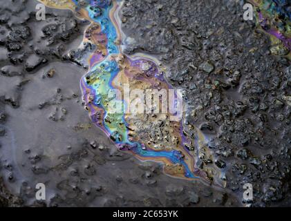 Gasoline flows on the pavement. Stock Photo