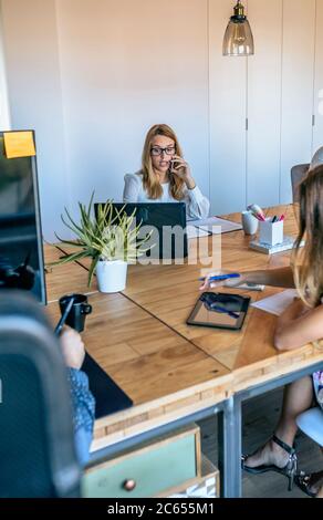 People working in a coworking office Stock Photo