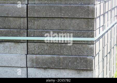 Stack of gray paving slabs. Construction of sidewalks. Building materials for the construction of the sidewalk. Stock Photo