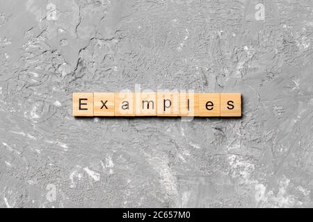 examples word written on wood block. examples text on table, concept ...