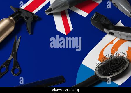 Anguilla flag with hair cutting tools. Combs, scissors and hairdressing tools in a beauty salon desktop on a national wooden background. Stock Photo
