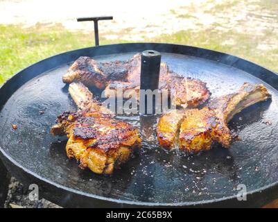 Three steaks are fried in their own juice on pan. Summer season hot food Stock Photo