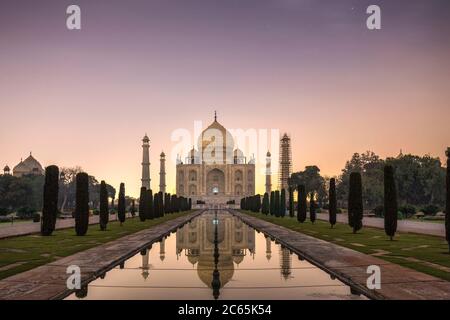 Taj Mahal shot at night with moon light at Yamuna river at sunset Agra, India. Stock Photo