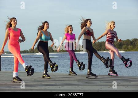 young girl exercising with kangoo shoes. sport girl in the gym training. Kangoo  jumping. Beautiful girls in Kangoo Jumping training in the gym Stock Photo  - Alamy