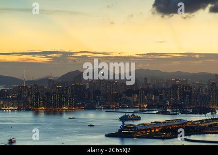 Skyline of Kowloon and Kai Tak cruise terminal at sunset, Hong Kong Stock Photo
