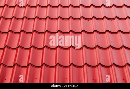 New red metal shingles roof texture, background photo Stock Photo