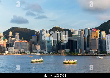 Skyline of Hong Kong Island and Star Ferry, Hong Kong Stock Photo