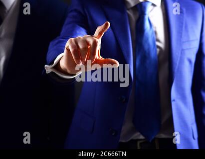 Man touching screen. Businessman pressing touchscreen button. Male hand uses modern screen. Update technologies, business success, innovations and communication concept. Progress, user-friendly. Stock Photo