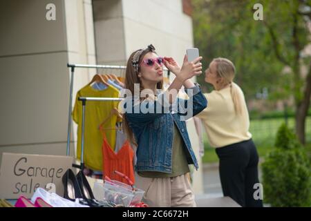 Joyful long haired woman posing for a selfie Stock Photo