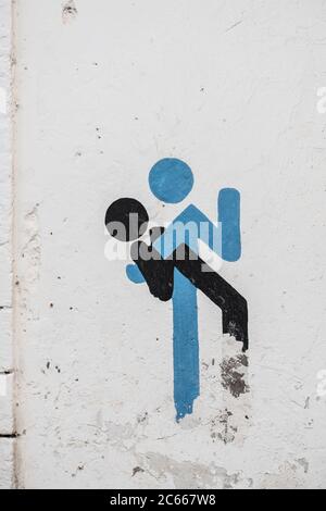 Symbol of a couple on a white wall Stock Photo
