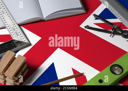 United Kingdom national flag on profession concept with architect desk and tools background. Top view mock-up. Stock Photo