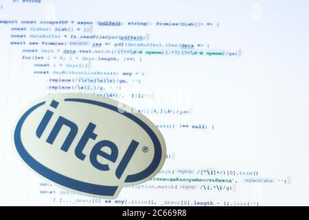 Moscow, Russia - 1 June 2020: Intel logo sign with program code on background Illustrative Editorial Stock Photo