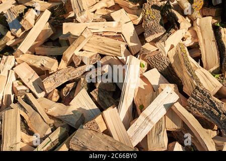 Largely chopped firewood, piled in a heap, close-up Stock Photo
