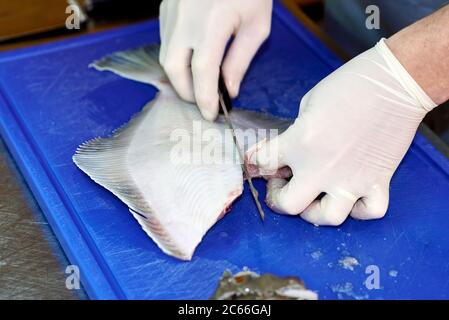 Filleting a plaice step-by-step Stock Photo