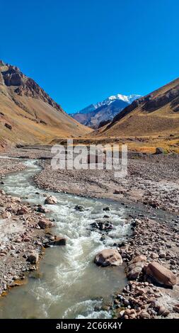 River in Aconcagua National Park, Aconcagua Mountain in the background, Mendoza Province, Argentina Stock Photo