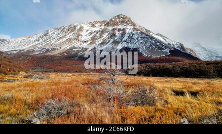 Snow-covered mountain surrounded by autumn landscape, Argentina Stock Photo