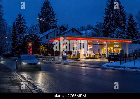 Illuminated gas station in winter at night, Tutzing, Bavaria, Germany, Europe Stock Photo