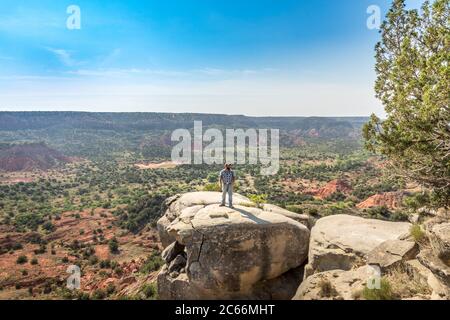 Man standing on the edge of a cliff, Palo Duro Canyin State Park, Texas Stock Photo