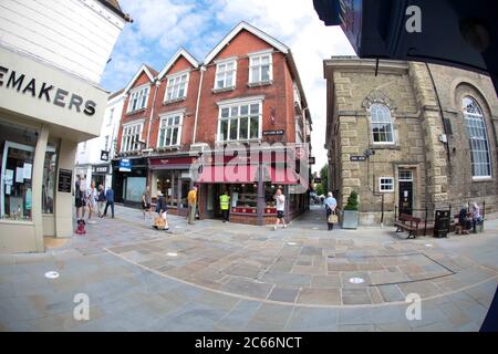 Social distancing - shops re-open in Butcher Row Salisbury after the Coronavirus Lockdown  Wiltshire UK . July 2020. Stock Photo