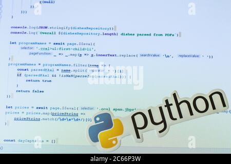 Moscow, Russia - 1 June 2020: Python logo sign with program code on background Illustrative Editorial Stock Photo