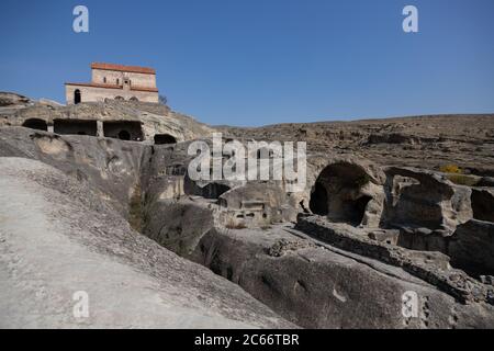 Uplistsikhe is an ancient, late Bronze Age,rock-hewn town in eastern Georgia Stock Photo