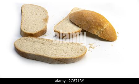 Wheat flour homemade round bread and slices of bread on a white background. Stock Photo