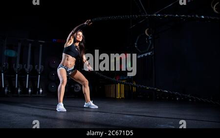 young athletic woman training in gym Stock Photo