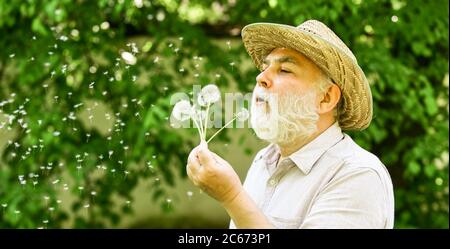 Mental Health. Peaceful Guy Blowing Dandelion. Happy And Carefree