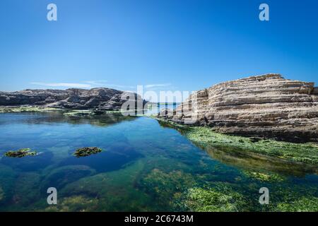 Rocks on Mediterranean Sea coast near famous Pigeon Rock in Beirut, Lebanon Stock Photo