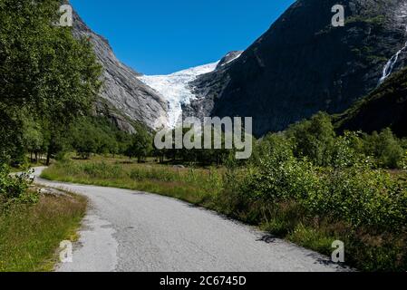 Briksdalsbreen/The Briksdal Glacier, Nordfjord, Norway (July 2020) is a branch of Jostedalsbreen. Last winter there fell 7 metres snow on top of it Stock Photo
