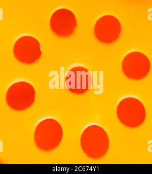 Abstract plastic ground with round holes in yellow Stock Photo