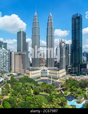 Petronas Twin Towers and downtown skyline with KLCC Park in the foreground, Kuala Lumpur, Malaysia Stock Photo