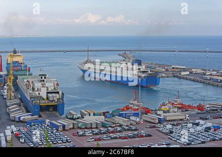 Salerno, Italy - June 27, 2014: Trucks Transport Docked Ferry in Cargo Port in Salerno, Italy. Stock Photo